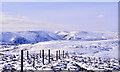 NN9233 : Fence post line descending from summit of Meall Reamhar by Trevor Littlewood