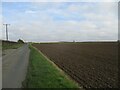 TA1443 : Looking  east  on  Whins  Lane  toward  Rise  Road  crossing by Martin Dawes