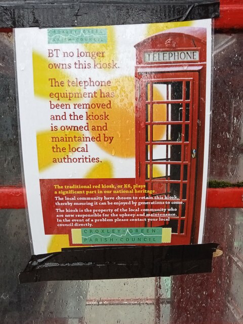 Notice on side of telephone box in New Parade