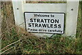 TG2120 : Stratton Strawless Village Name sign by Geographer