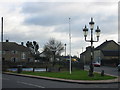  : Pond, sign, flagpost and fancy streetlamp by Chris Stafford