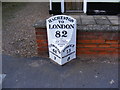 TM3056 : Milepost in Hacheston by Geographer