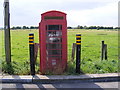 TM4598 : Telephone Box in Haddiscoe Railway Station Car Park by Geographer