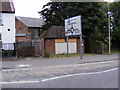 TM3877 : Disused Public Convenience & Roadsign by Geographer