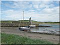 NX0940 : Port Logan harbour and the ruined lighthouse by Ann Cook