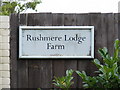 TM4259 : Rushmere Lodge Farm sign by Geographer