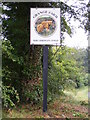 TM3677 : Grange Farm sign by Geographer