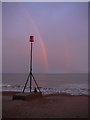 TQ7106 : Evening rainbow and coastal groyne marker at Cooden Beach by Colin Park