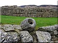 NY7666 : Stone vessel and north-west wall of Roman Fort by Andrew Curtis