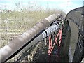 SE3026 : Pipe bridge over the railway by Christine Johnstone