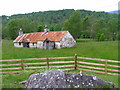 NH3129 : Derelict cottages at Fasnakyle by Dave Fergusson