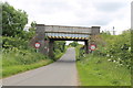 TF0367 : Railway bridge over Moor Lane by J.Hannan-Briggs