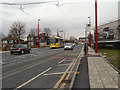 SJ9098 : Metrolink Tram on Manchester Road by David Dixon