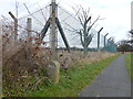 TL2682 : RAF Upwood - Perimeter fencing by Richard Humphrey