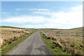 NX6589 : Moorland road near Auchenshinnoch Bridge by Ann Cook