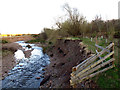 NT9926 : Erosion on Wooler Water by Stephen Craven