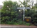 SX7966 : Beaston Cross signpost and grit bin by David Smith