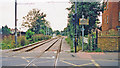 TQ2569 : Croydon Tramlink: Kingston Road level-crossing and Merton Park tram-stop, 2000 by Ben Brooksbank