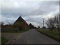 TM2339 : Bridge Road & entrance to White Housde Farm by Geographer