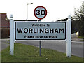 TM4489 : Worlingham Village Name sign on Lowestoft Road by Geographer