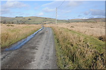  : Road crossing Littlehill Common by Philip Halling