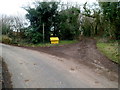 ST4490 : Yellow grit bin at a junction, Five Lanes, Monmouthshire by Jaggery