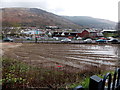 SS9596 : Muddy vacant site at the edge of Treorchy railway station by Jaggery