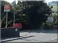 SO2972 : Knighton railway station entrance and town boundary sign by Jaggery