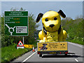 SS5732 : A very large yellow dog approaching Portmore roundabout on the A361 by Roger A Smith