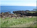 NT9266 : Exposed rocks below Yellow Craig Head by Graham Robson