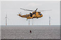 TM1714 : RNLI Volunteer leaving Sea King Helicopter, Clacton, Essex by Christine Matthews