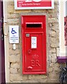 TF1205 : Wall-mounted EIIR postbox at Helpston Post Office by Paul Bryan