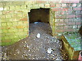 SU0669 : Fireplace in bunker, WW2 gun emplacement in round barrow, north of West Down by Vieve Forward