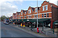 SJ8193 : A row of bars and restaurants on Barlow Moor Road by Phil Champion