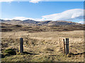 NM7031 : Moorland beyond gateway by Trevor Littlewood