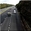 SS9082 : White vans enter the M4 westbound from junction 36, Sarn by Jaggery