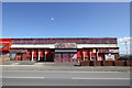 SH9980 : Derelict building on Rhyl seafront by Jeff Buck