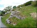 SH5741 : Exposed rock alongside the road to Llyn Du by Christine Johnstone