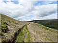 SD9923 : Water channel east of Withens Clough Reservoir by Trevor Littlewood