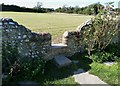 SZ7798 : Stile in the wall of West Wittering churchyard by Rob Farrow