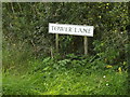 TM1164 : Tower Lane sign by Geographer