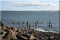 NU1341 : Shoreline by Lindisfarne Castle looking towards Bamburgh Castle by I Love Colour