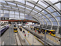 SJ8499 : Metrolink Platforms at Victoria Station by David Dixon