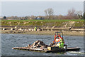 SP9114 : Repairing Startops Reservoir (13) Transporting the Rocks by Raft by Chris Reynolds