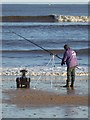 NZ3573 : Sea angler on Whitley Sands by Oliver Dixon