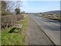 NY9663 : Bench by the A695 by Oliver Dixon