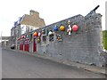 NT6779 : Colourful display in Castle Gate by Oliver Dixon