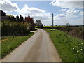 TM1256 : Footpath to The Green & entrance of Home Farm by Geographer