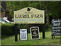 TM1648 : Laurel Farm Garden Centre sign by Geographer