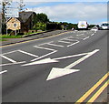 SO2701 : White arrows on the A4043 Osborne Road, Pontnewynydd by Jaggery